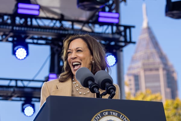 Democratic presidential candidate Kamala Harris speaks during her campaign rally Saturday at an Atlanta Civic Center parking lot in Atlanta. She drew a crowd of about 12,000 people, telling them to "turn the page" on Donald Trump's divisive policies. (Arvin Temkar / AJC)