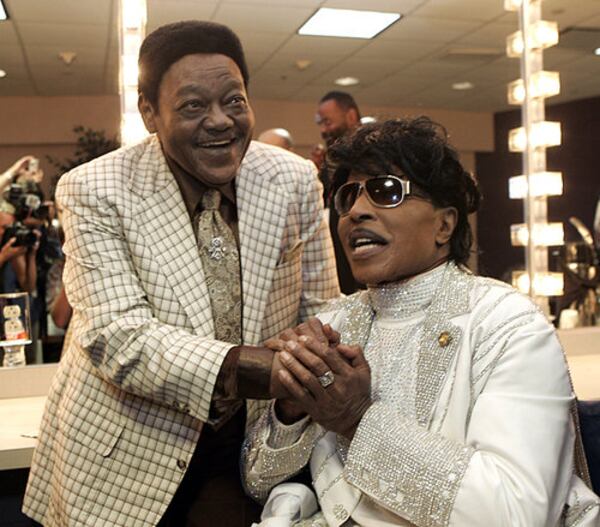 Fats Domino visits with Little Richard in a dressing room after Richards' performance at The Domino Effect tribute show in 2009.