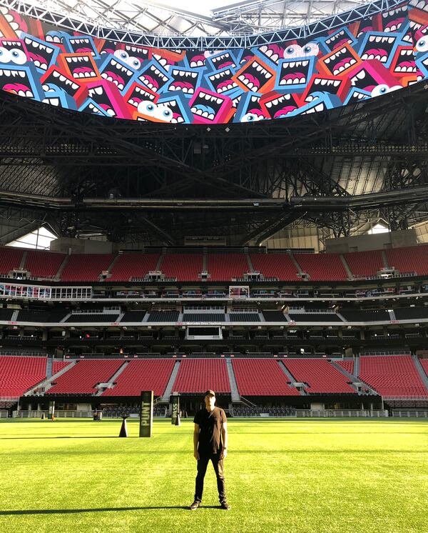 Greg Mike with a temporary installation of his Larry Loudmoufs at Mercedes-Benz Stadium as part of the "Creative Mornings" event.
Courtesy of Greg Mike