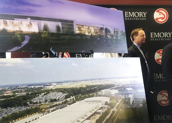 November 10, 2016, ATLANTA — Atlanta Hawks coach Mike Budenholzer stands beside renderings of a 3,500-seat arena that would host Atlanta’s new NBA Development League team beginning in 2019. (AP Photo/Paul Newberry)