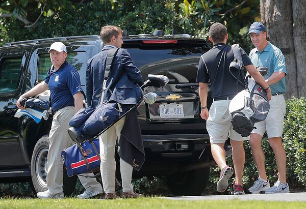 Former NFL football quarterback Peyton Manning (right) exits a vehicle after arriving on the South Lawn of the White House in Washington, Sunday, June 4, 2017. Manning was traveling in President Donald Trump's motorcade which was returning from Trump National Golf Club in Sterling, Va.