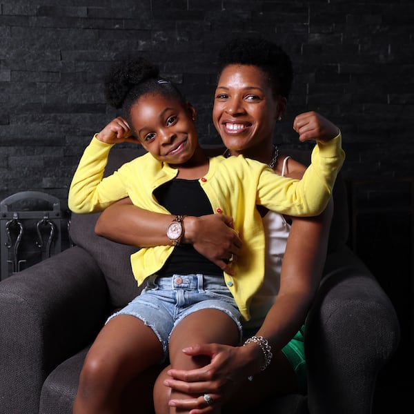 At age 29, Michelle Bradley Emebo had hypertension brought on by the pregnancy of her daughter Sarai, both shown here May 6, 2021. But Bradley Emebo changed her lifestyle to be more healthy. (Terrence Antonio James/Chicago Tribune/TNS)