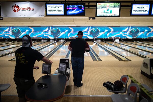 Johnny Mayfield prepares to roll as Ryan Lowery watches from a distance.  BRANDEN CAMP/SPECIAL