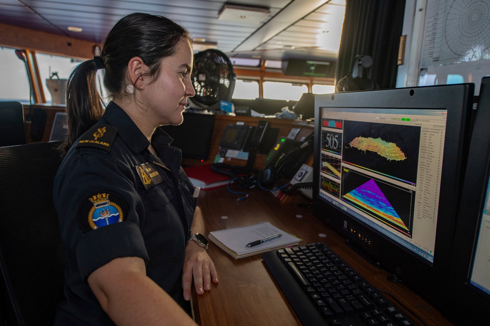 In this undated photo provided by New Zealand's Defence Public Affairs, a hydrographer surveys uncharted positions during the transit to Vanuatu on Op Calypso onboard HMNZS Manawanui. (Petty Officer Chris Weissenborn/Defence Public Affairs via AP)