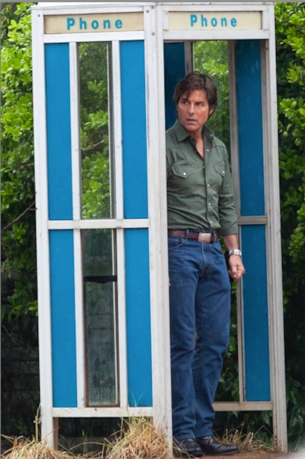 Tom Cruise in a phone booth while filming "American Made" in Ball Ground, Georgia in 2015. 