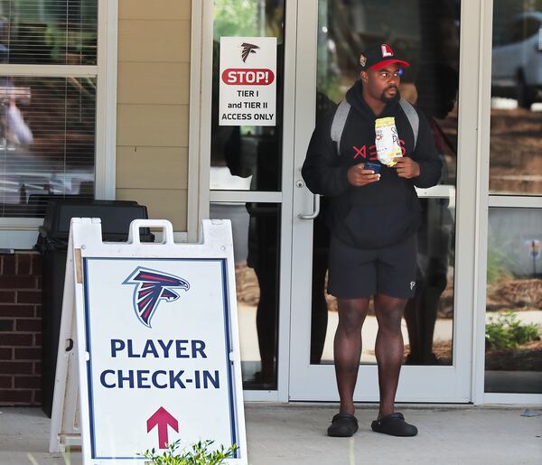 Falcons running back Mike Davis leaves player check-in after he finishes reporting after arriving at the team practice facility for training camp Tuesday, July 27, 2021, in Flowery Branch. (Curtis Compton / Curtis.Compton@ajc.com)