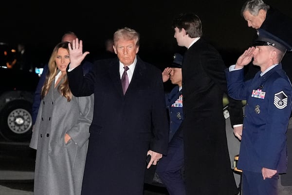 President-elect Donald Trump and Melania Trump, walk off an Air Force Special Mission airplane as they arrive at Dulles International Airport, Saturday, Jan. 18, 2025, in Dulles, Va. (AP Photo/Alex Brandon)