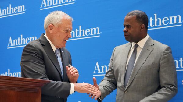 Then-Gov. Nathan Deal, left, and then-Atlanta Mayor Kasim Reed had a tight relationship and worked in cooperation on numerous issues. Gov. Brian Kemp and Atlanta Mayor Andre Dickens have made efforts to form a similar bond. BOB ANDRES /BANDRES@AJC.COM