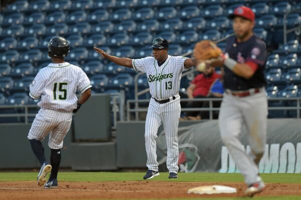 Gwinnett Stripers’ Danny Santana (15) is called safe at first allowing for a run to score in their game against the Louisville Bats in a minor league baseball game at Coolray Field on Monday, August 13, 2018, in Lawrenceville. JENNA EASON / JENNA.EASON@COXINC.COM