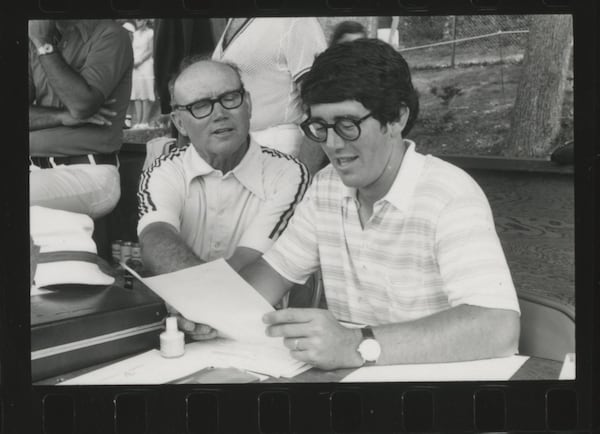 The late Dan Magill (L) talks with his protege, Greg McGarity, during a tennis match on the University of Georgia campus in the 1970s. (UGA photo)