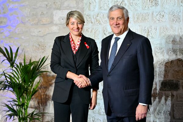 Italy's Foreign Minister Antonio Tajani, right, welcomes Canada's Foreign Affairs Minister Melanie Joly at the G7 Foreign Ministers meeting in Anagni, central Italy, Monday, Nov. 25, 2024. (Andreas Solaro/Pool Photo via AP)