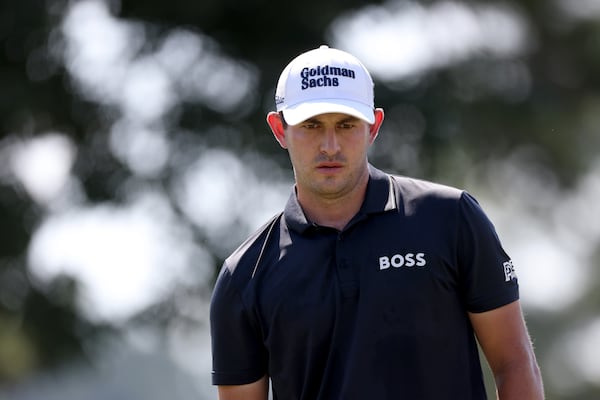 Patrick Cantlay prepares to putt on the first green during the third round of the Tour Championship at East Lake Golf Club, Saturday, August 27, 2022, in Atlanta. (Jason Getz / Jason.Getz@ajc.com)