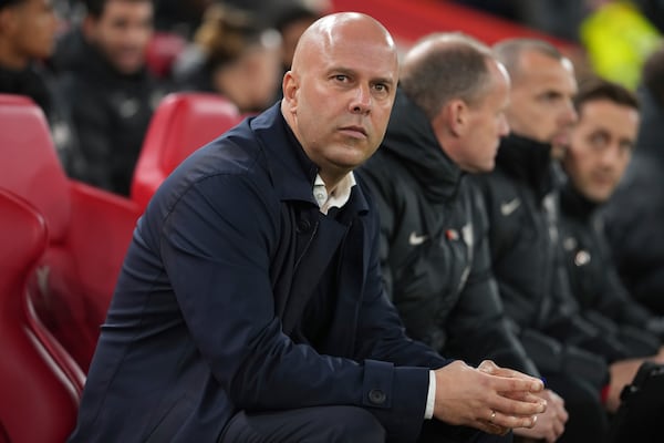 Liverpool's manager Arne Slot waits for the beginning the English Premier League soccer match against Aston Villa at the Anfield stadium in Liverpool, Saturday, Nov. 9, 2024. (AP Photo/Jon Super)