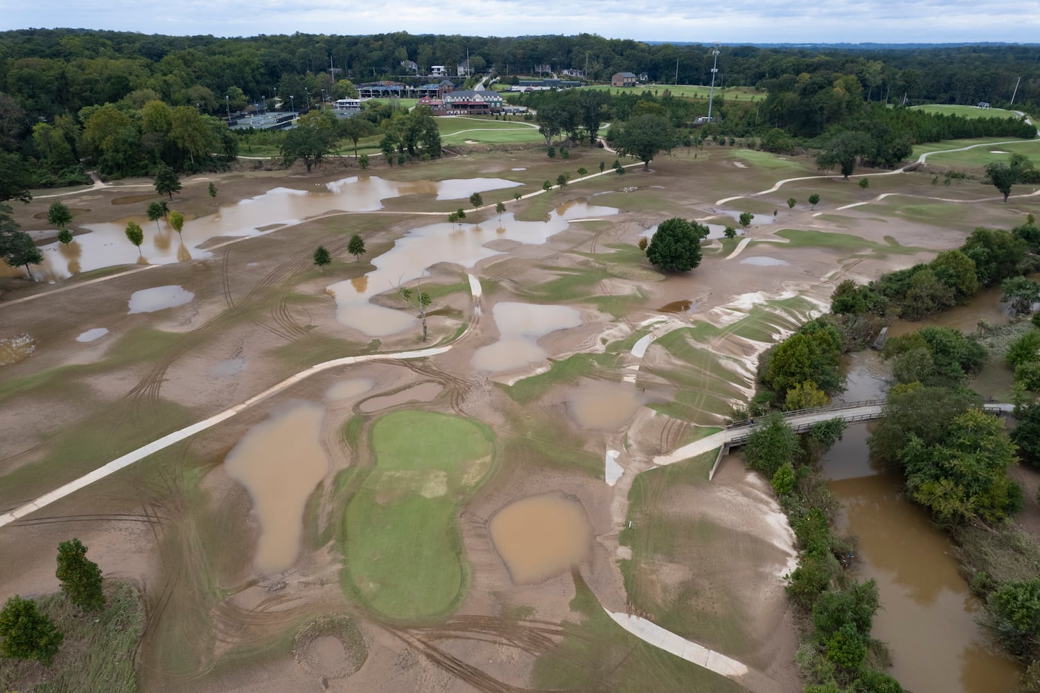 Mud and standing water cover much of the Bobby Jones Golf Course in Atlanta on Saturday, Sept. 28, 2024 after Peachtree Creek spilled its banks from Hurricane Helene.   Ben Gray for the Atlanta Journal-Constitution