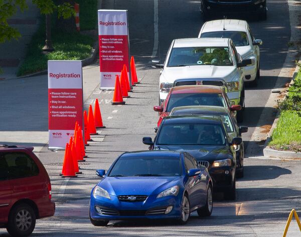 Cars wait in line at the COVID-19 drive-through testing center near Georgia Tech Monday, April 6, 2020.  STEVE SCHAEFER / SPECIAL TO THE AJC