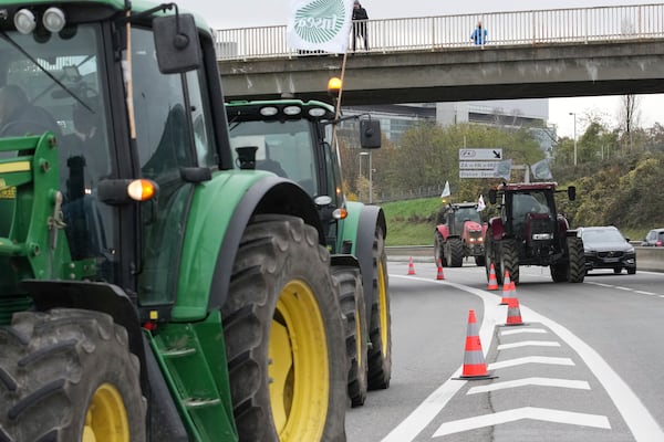 Farmers block a speedway to protest the EU-Mercosur trade agreement, Monday, Nov. 18, 2024 in Velizy-Villacoublay outside Paris. (AP Photo/Christophe Ena)