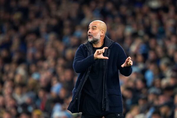 Manchester City's head coach Pep Guardiola reacts during the English Premier League soccer match between Manchester City and Manchester United at the Etihad Stadium in Manchester, Sunday, Dec. 15, 2024. (AP Photo/Dave Thompson)