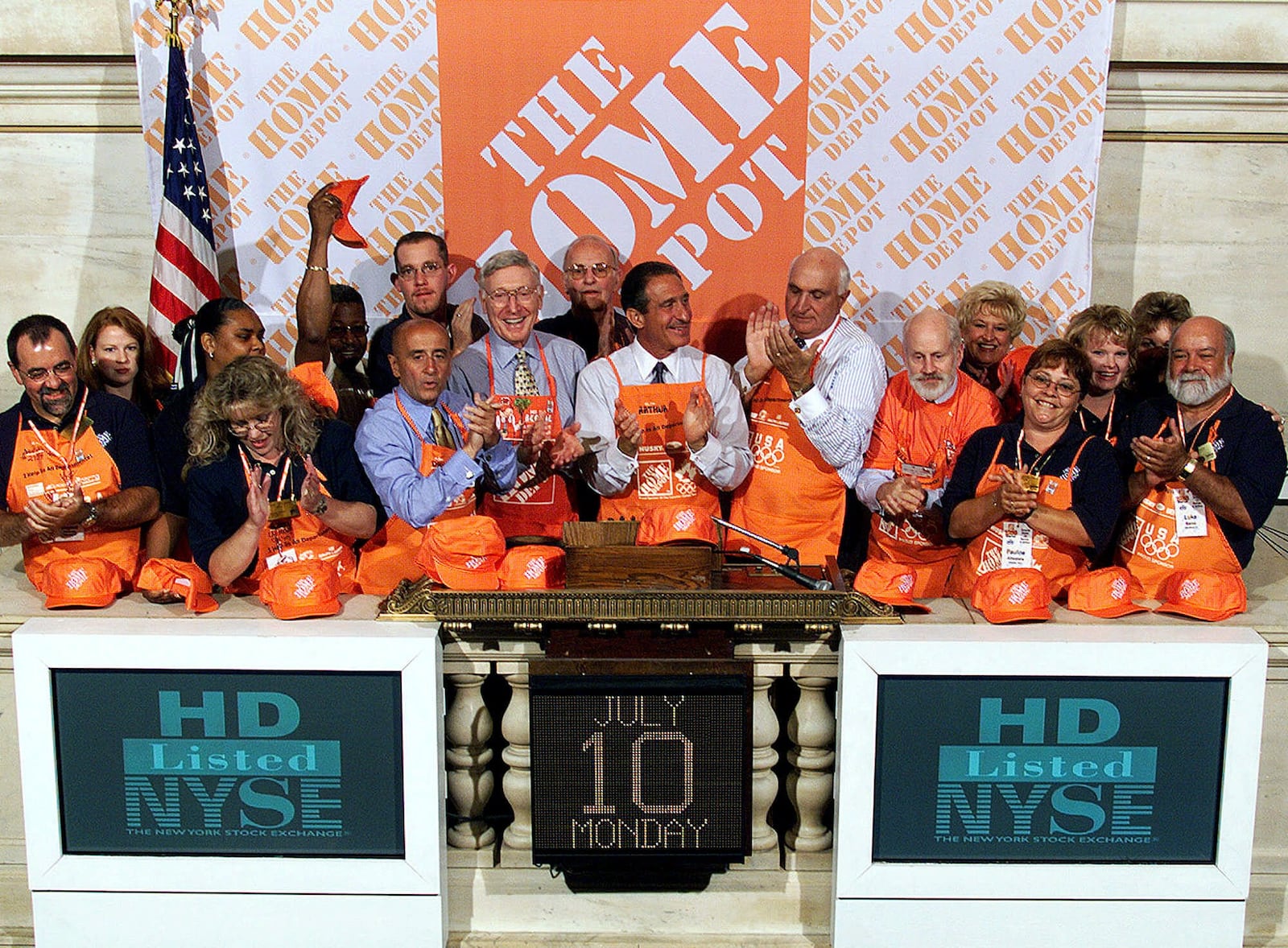 New York Stock Exchange Chairman Richard Grasso, third from left front, Home Depot Chairman Bernie Marcus, left center, Home Depot CEO and President Arthur Blank, center, and Co-Founder Ken Langone, right center, applaud after ringing the opening bell at the NYSE Monday, July 10, 2000, celebrating Home Depot's 1000th store.