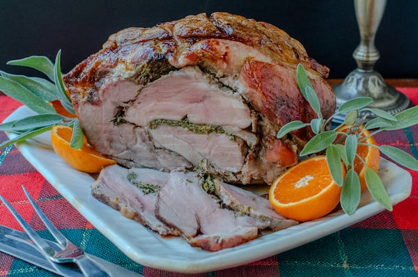 Pork Shoulder Porchetta is a budget-conscious, spectacular main course for the holidays. (Virginia Willis for The Atlanta Journal-Constitution)