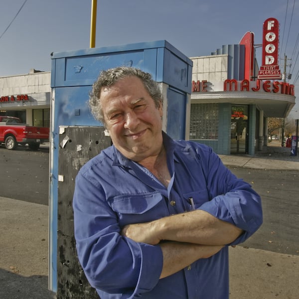 Artist John Baeder is seen outside the Majestic Diner in Atlanta in a photo from 2007. Baeder has painted photorealistic portraits of many diners, including this one. (Louie Favorite/AJC file)