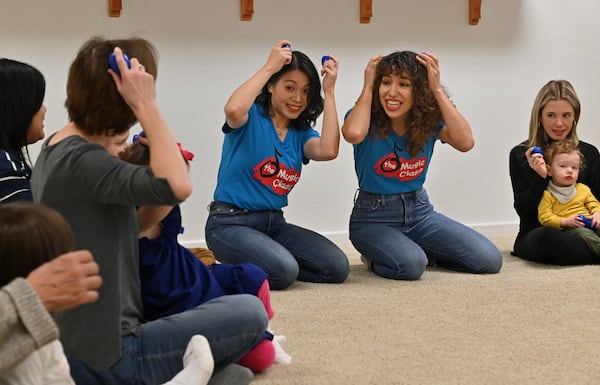 Lan Lin (left) and Raina Sayer, who work at The Music Class, lead a class that will be shared online with families in China. With classes canceled in China during the coronavirus outbreak, they are filming classes here in Atlanta and broadcasting them free on a WeChat channel. (Hyosub Shin / Hyosub.Shin@ajc.com)