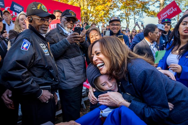 Democratic presidential nominee Vice President Kamala Harris hugs a child after speaking during a campaign event at Washington Crossing Historic Park, in Washington Crossing, Pa., Wednesday, Oct. 16, 2024. (AP Photo/Jacquelyn Martin)