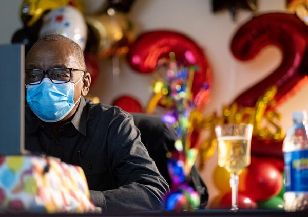 Charles Brown tears up while listening to family and coworkers sing his praises during a surprise celebration Friday, Dec. 18, 2020, to honor his retirement after 32 years of driving a school bus for Atlanta Public Schools. Ben Gray for the Atlanta Journal-Constitution