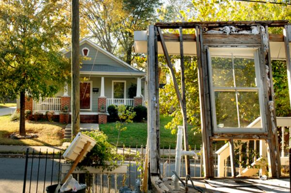 Two houses that face each other across Bradley Street show the differences that exist when a neighborhood is undergoing gentrification.