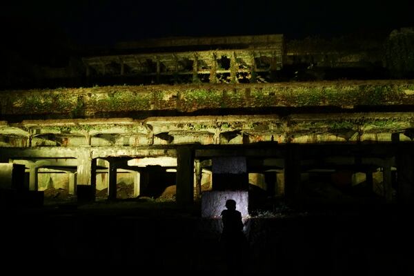 One of the industrial heritages Kitazawa Flotation Plant, a processing gold ore plant, is illuminated in Sado, Niigata prefecture, Japan, Saturday, Nov. 23, 2024. (AP Photo/Eugene Hoshiko)