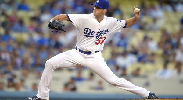 Alex Wood, traded to the Dodgers in July, is one of at least 17 players who were with the Braves within the past year and are now with organizations that have either secured postseason berths or remain in contention. (AP photo)