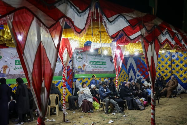 Relatives and friends of Palestinian prisoners to be released from Israeli prison wait for their arrival in Khan Younis, southern Gaza Strip, late Wednesday Feb. 27, 2025. (AP Photo/Jehad Alshrafi)