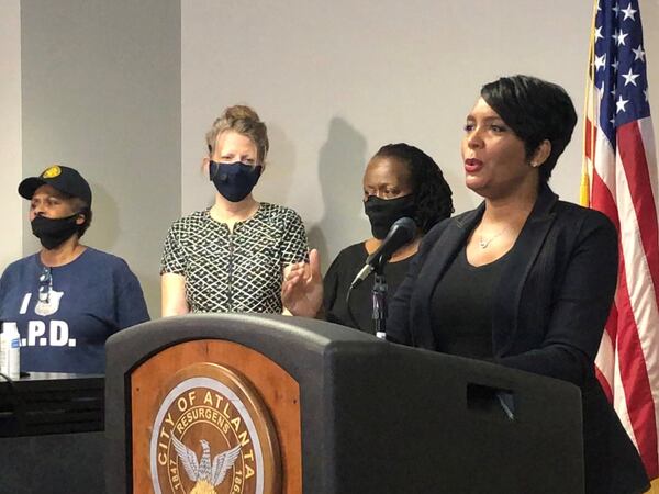 Atlanta Mayor Keisha Lance Bottoms, right, speaks during a press conference at Atlanta police headquarters about the Saturday night shooting death of 8-year-old Secoriea Turner. J. SCOTT TRUBEY/SCOTTl.TRUBEY@AJC.COM