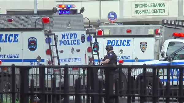 In this image taken from video, emergency personnel converge on Bronx Lebanon Hospital in New York, after a gunman opened fire there on Friday, June 30, 2017. (AP Photo/Joseph Frederick)