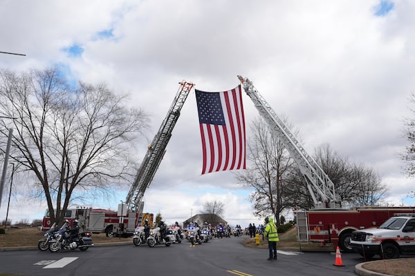 The police procession arrives for the funeral of West York Borough Police Officer Andrew Duarte at Living Word Community Church, in Red Lion, Pa., Friday, Feb. 28, 2025. (AP Photo/Matt Rourke)