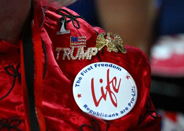 A Georgia delegate decorates in support of Republican presidential candidate former President Donald Trump during the first day of the Republican National Convention, Monday, July 15, 2024, in downtown Milwaukee, WI. (Hyosub Shin / AJC)