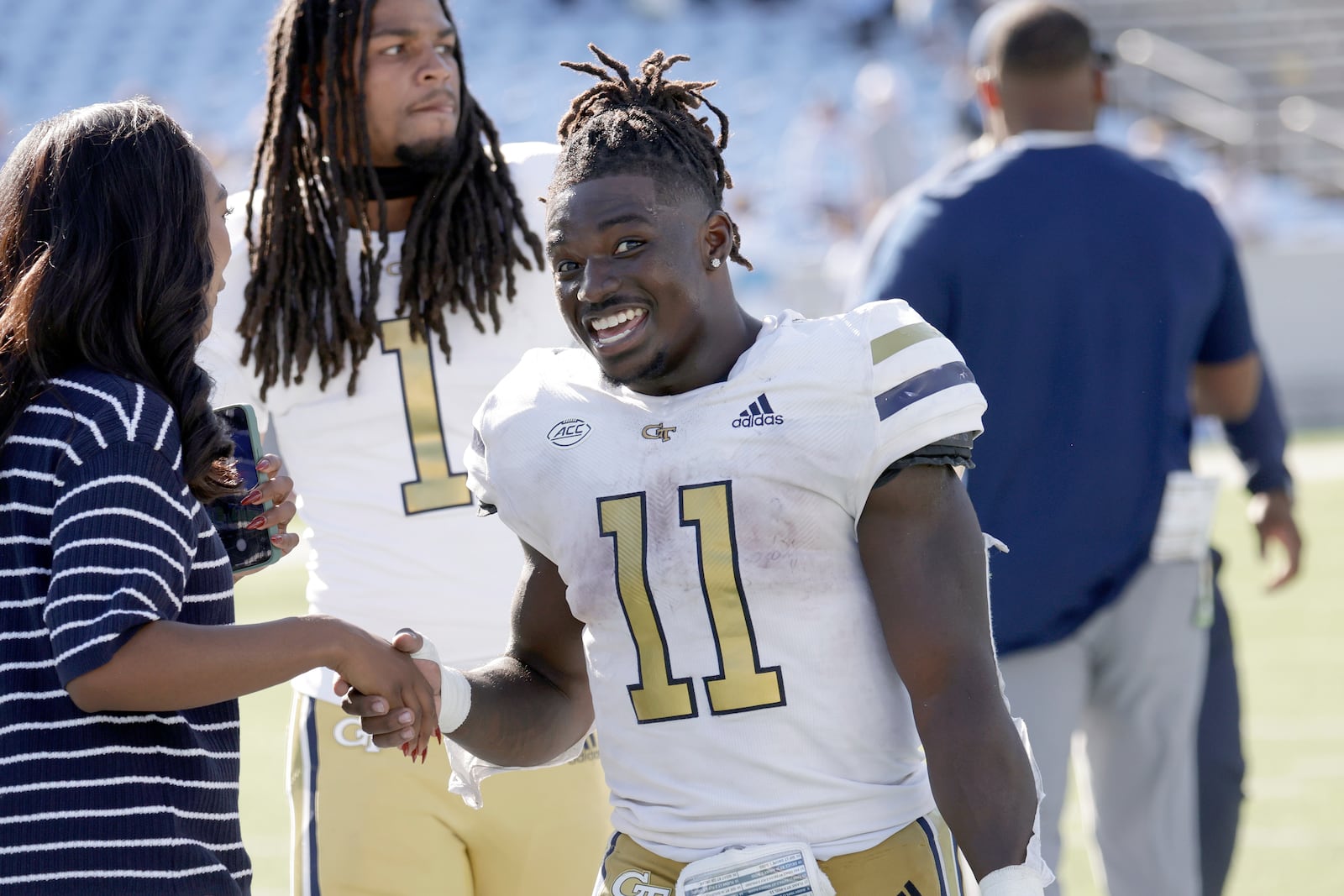 Georgia Tech running back Jamal Haynes (11) celebrates as he leaves the field after he scored the winning in an NCAA college football game against North Carolina, Saturday, Oct. 12, 2024, in Chapel Hill, N.C. (AP Photo/Chris Seward)