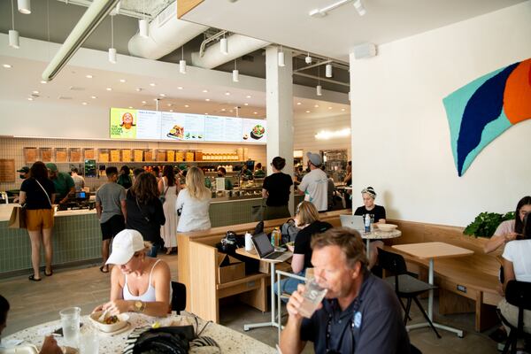 The Sweetgreen interior dining and ordering area at the Ponce City Market location. While the Sweetgreen kitchens, order counters and pickup and delivery areas are similar at all locations, the build-out and decor are unique to each restaurant. (Mia Yakel for The Atlanta Journal-Constitution)