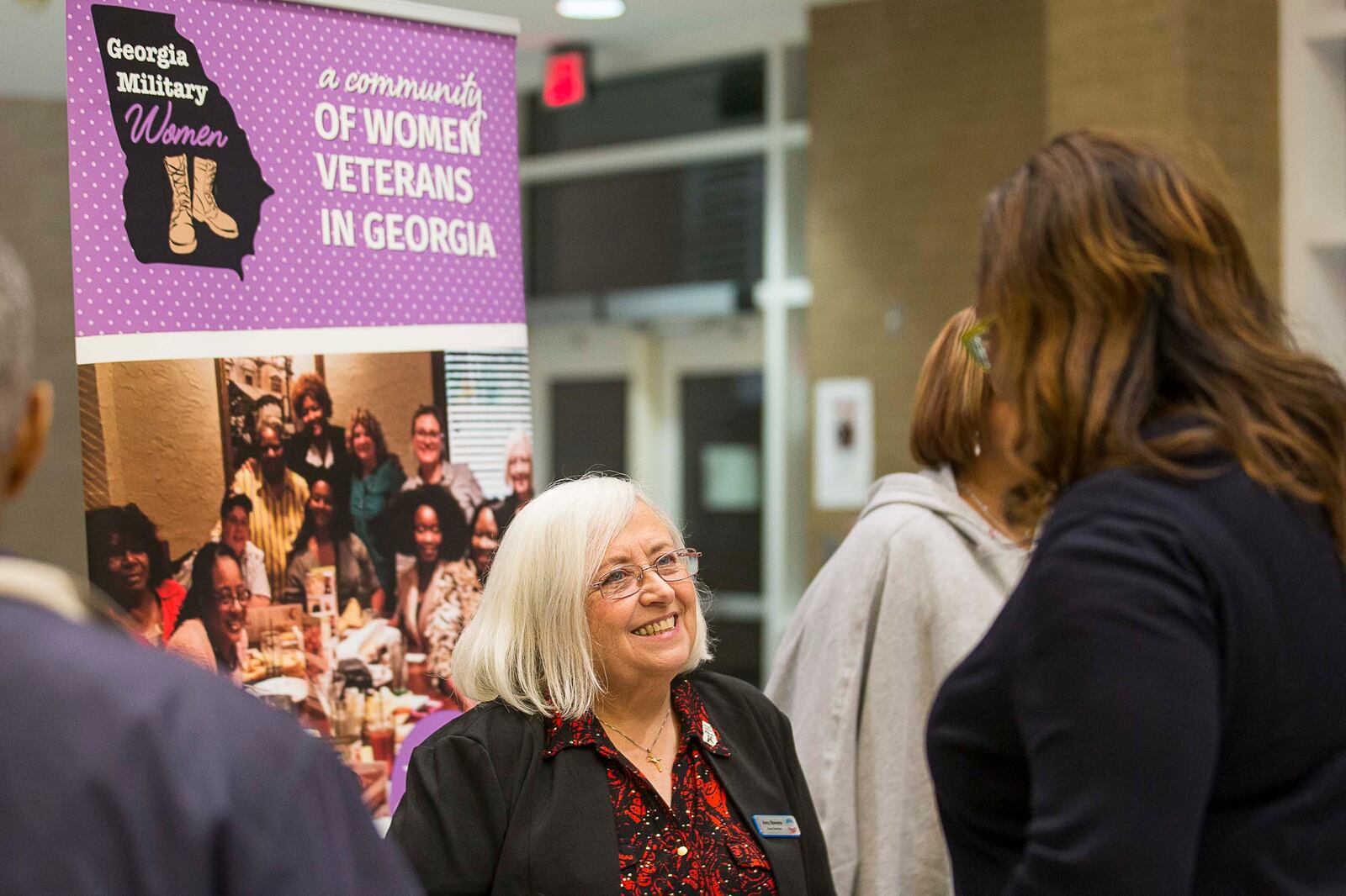 Georgia Military Women's founder and U.S Navy Veteran Amy Stevens (center) speaks with U.S. Army Veteran Nyala Allen in 2019. Stevens says she believes the VA does good medical work, overall, with Georgia veterans. (ALYSSA POINTER/ALYSSA.POINTER@AJC.COM)