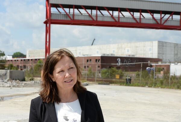 Doraville Mayor Donna Pittman walks through the construction site of Third Rail Studios in May 2016, one of the first developments at the former General Motors site. KENT D. JOHNSON /kdjohnson@ajc.com