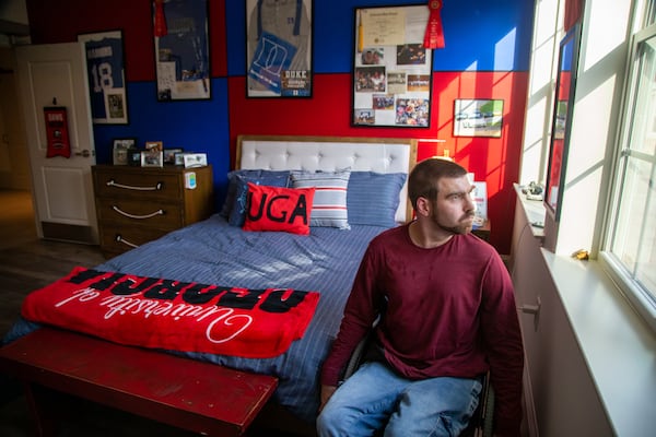 Matt Thompson looks out the window in his room at Champions Place.  PHIL SKINNER FOR THE ATLANTA JOURNAL-CONSTITUTION.