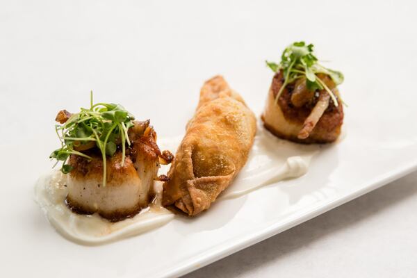 Seared scallops served with a house pierogi and guanciale creme fraiche at Rose and Rye. CONTRIBUTED BY HENRI HOLLIS