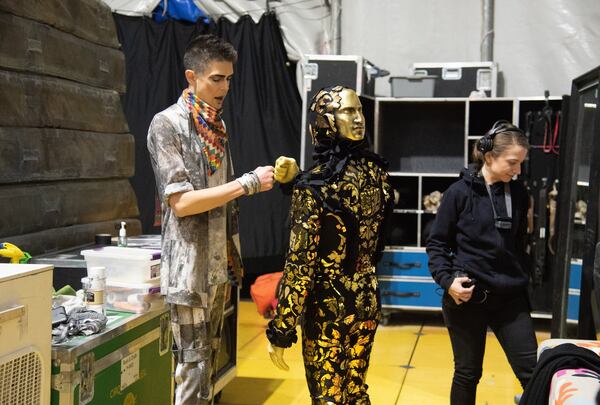 Drummer and band leader Ben Todd (left) gives a fist bump to guitarist Will Lawrence backstage before Cirque du Soleil Volta under the big top tent at Atlantic Station on Thursday, December 12, 2019.  (Hyosub Shin / Hyosub.Shin@ajc.com)