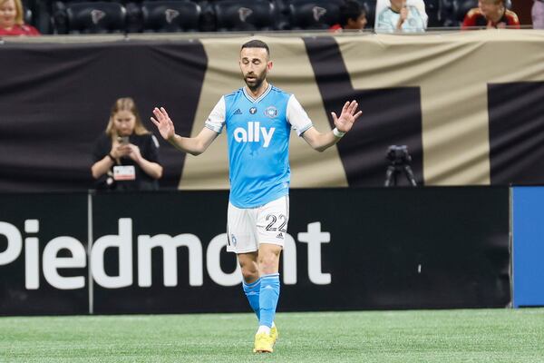 Charlotte FC midfielder Justin Meram (22) doesn't celebrate after scoring against Atlanta United, his former team, on Saturday, May 13, 2023, in Atlanta.
 Miguel Martinez / miguel.martinezjimenez@ajc.com