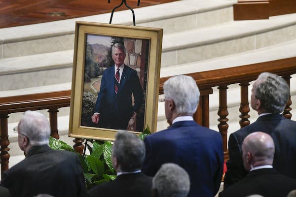 Former Presidents Jimmy Carter, left, Bill Clinton, front and center, and George W. Bush face a portrait of Zell Miller, the former Georgia governor and U.S. senator, as they attend his funeral Tuesday at Peachtree Road United Methodist Church in Atlanta. (John Amis)