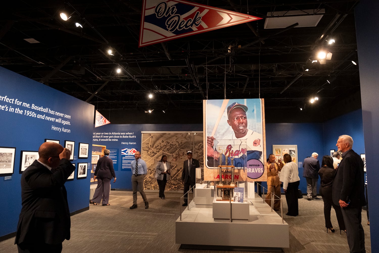 Guests view the Atlanta History Center exhibit “More Than Brave: The Life of Henry Aaron” on Monday, April 8, 2024.   (Ben Gray / Ben@BenGray.com)