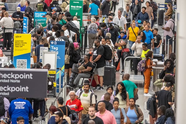 Travelers faced long lines on Tuesday at Hartsfield-Jackson International Airport.