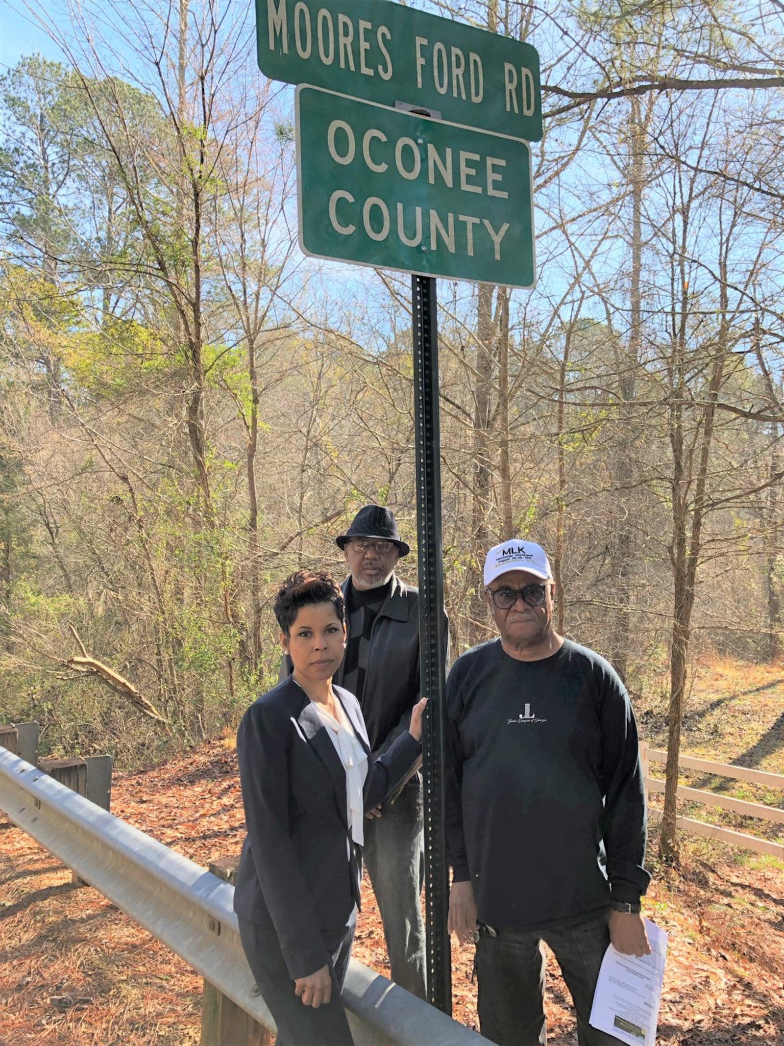 Former state Rep. Tyrone Brooks (right) poses with Dana Young Levett and the Rev. Ron Brown near where George and Mae Dorsey and Roger and Dorothy Malcom were lynched in 1946. Levett’s grandfather Dan Young buried the victims. GRACIE BONDS STAPLES / GSTAPLES@AJC.COM