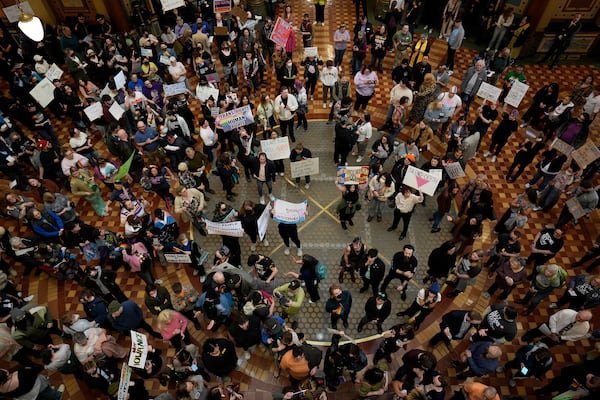 Protesters fill the Iowa state Capitol in Des Moines to denounce a bill that would strip the state civil rights code of protections based on gender identity, Thursday, Feb. 27, 2025, in Des Moines, Iowa. (AP Photo/Charlie Neibergall)