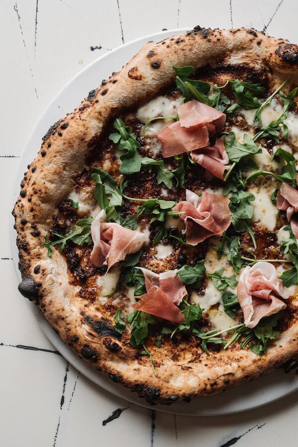 Varuni Napoli’s Fichissima pizza, crafted with homemade fig jam, fresh mozzarella, Gorgonzola, arugula, Prosciutto di Parma and Pecorino Romano, uses the fig jam as a sauce. It’s served on Saturdays and Sundays at the Midtown location only. CONTRIBUTED BY ANDREW THOMAS LEE PHOTOGRAPHY