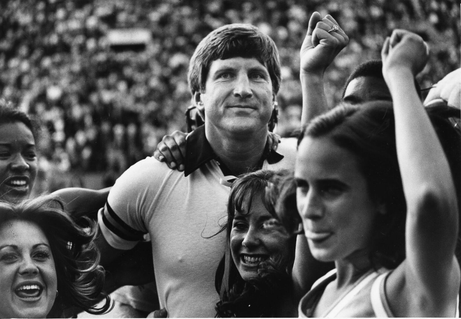 Georgia Tech coach Bill Curry celebrating tie against Notre Dame with Tech cheerleaders. Photo taken Nov. 8, 1980. (Bill Mahan/AJC staff)